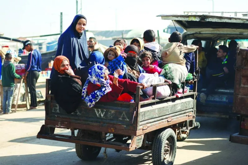 
Palestinians fleeing Khan Yunis, due to the Israeli ground operation, amid the ongoing conflict, arrive in Rafah in the southern Gaza Strip, yesterday. 