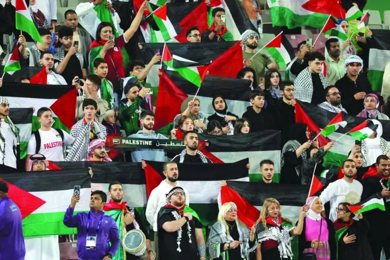 Palestine supporters at the Abdullah Bin Khalifa Stadium on Tuesday. (AFP)