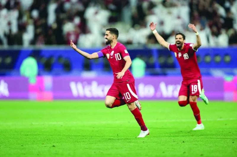 
Qatar captain Hasan al-Haydos celebrates after scoring against Tajikistan during the Asian Cup. 