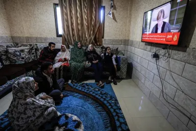 Members of a Palestinian family watch on a television set, the UN&#039;s top court in the Hague reading its initial decision in a case accusing Israel of genocide, in Rafah in the southern Gaza Strip on  Friday. AFP