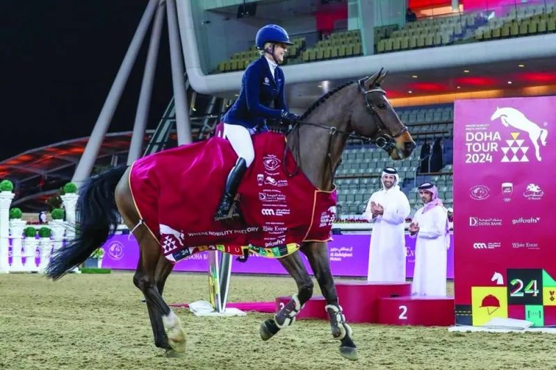 Evelina Tovek celebrates with 12-year-old gelding Moeboetoe v/D Roshoeve after her victory at the Doha Tour on Friday.