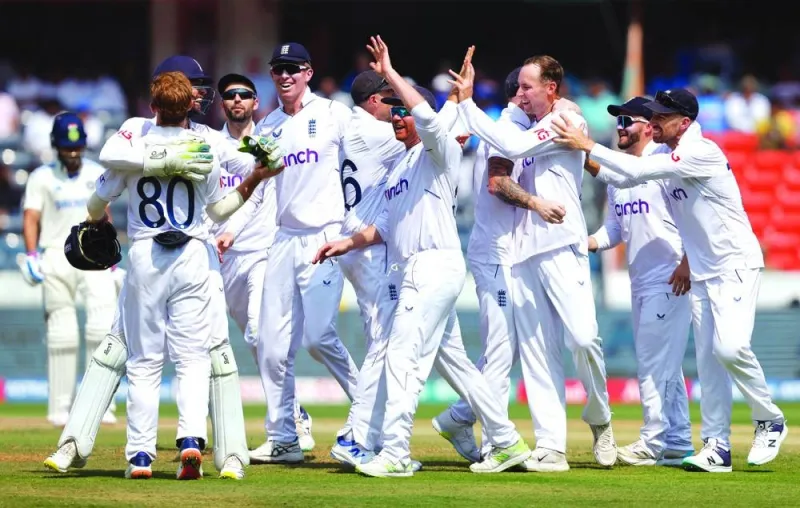 
England’s Tom Hartley celebrates with teammates after taking the wicket of India’s Shubman Gill, caught out by England’s Ollie Pope, during day four of the first Test in Hyderabad yesterday. (Reuters) 