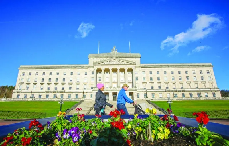 
Pedestrians walk past Parliament buildings, the seat of the Northern Ireland Assembly, in Stormont. 