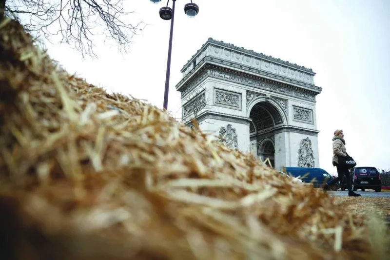 
Straw lies on a road and pavement near Paris’s Arc de Triomphe on the day of a protest by farmers over price pressures, taxes and green regulation, grievances shared by farmers across Europe. 