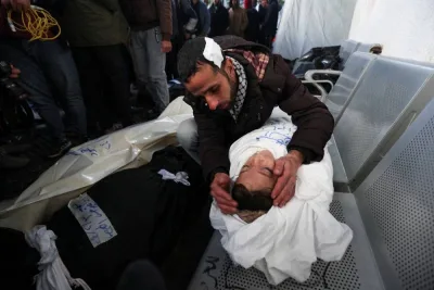 A mourner reacts near the body of a Palestinian child casualty killed in an Israeli airstrike in Rafah in the southern Gaza Strip on Saturday.