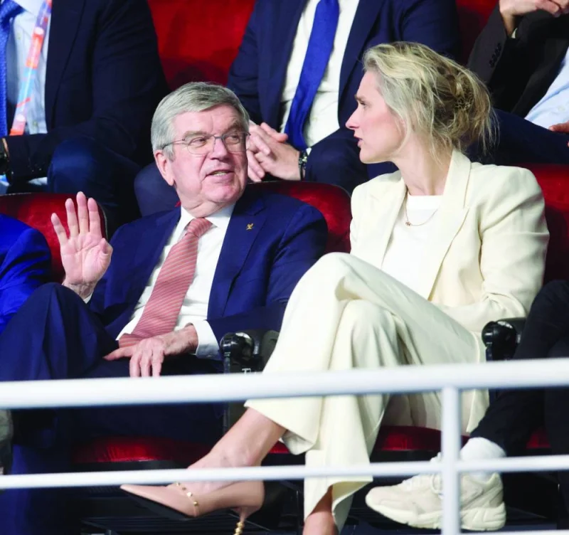 IOC President Thomas Bach (left)