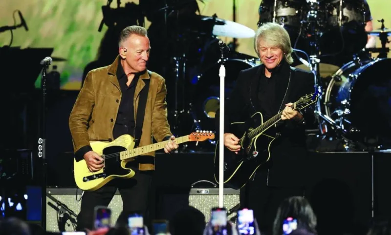 
Honouree US singer-songwriter Jon Bon Jovi (right) performs on stage with singer Bruce Springsteen during the 2024 MusiCares Person of the Year gala at the LA Convention Center in Los Angeles.  