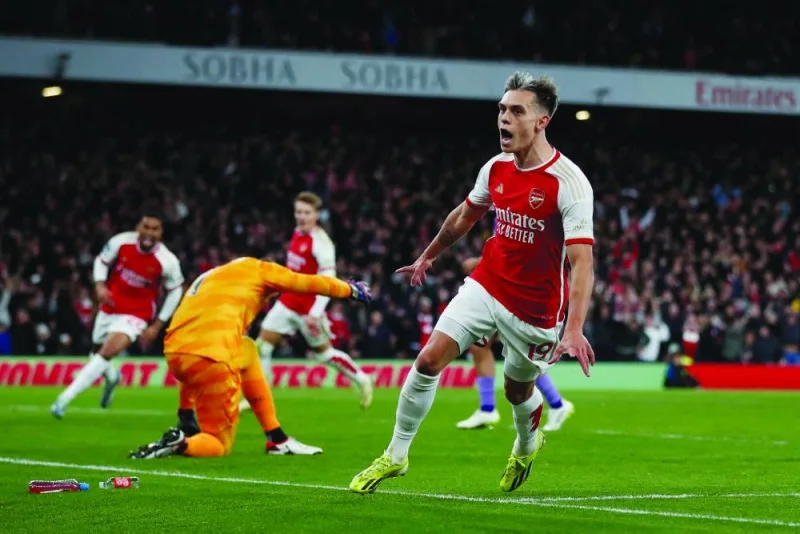
Arsenal’s Belgian midfielder Leandro Trossard celebrates after scoring his team’s third goal during the Premier League match against Liverpool at the Emirates Stadium in London yesterday. (AFP) 