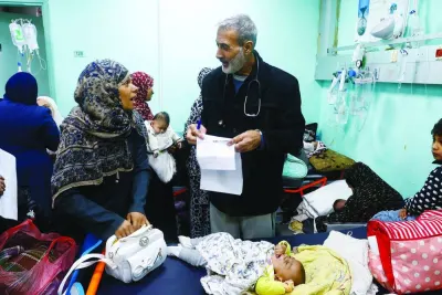 Palestinian doctor Said Abdulrahman Marouf, who was detained for 45 days and released on February 1, examines patients at Abu Yousef Al-Najjar Hospital in Rafah, in the southern Gaza Strip.