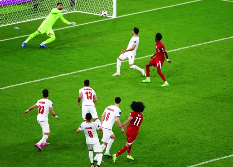 Qatar&#039;s Akram Afif scores their second goal. REUTERS