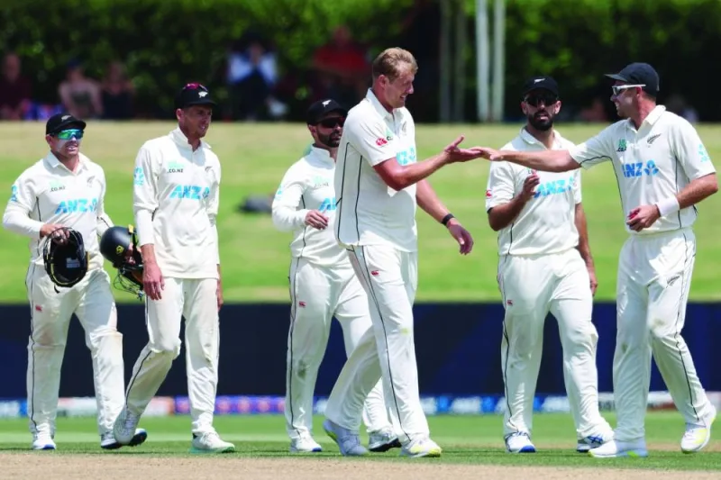 New Zealand’s Kyle Jamieson (centre) celebrates the wicket of South Africa’s Zubayr Hamza with teammates during day four of the first Test at the Bay Oval in Mount Maunganui on Wednesday. (AFP)