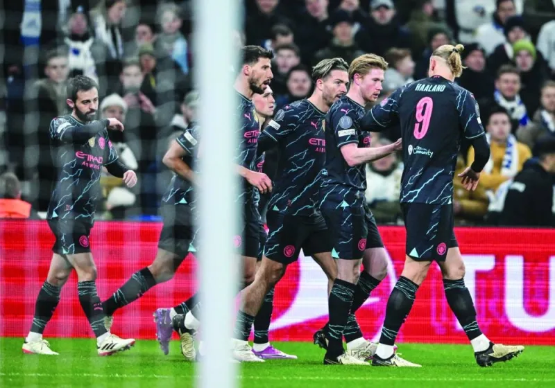 Manchester City’s Belgian midfielder Kevin De Bruyne (second from right) celebrates with teammates after scoring the opening goal during the UEFA Champions League round of 16 first-leg match against FC Copenhagen in Copenhagen. (AFP)