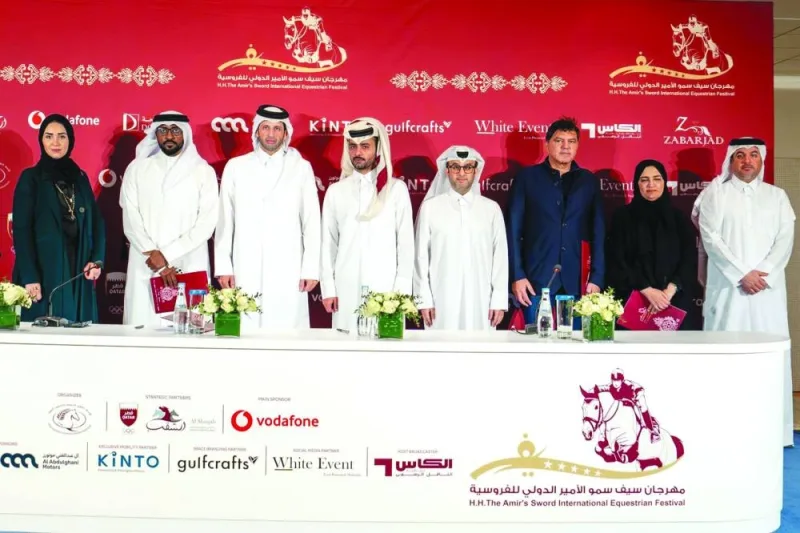 Sheikh Ahmed bin Nouh al-Thani, Chairman of the The HH The Amir Sword International Equestrian Festival Organising Committee, and Ahmed Jaber al-Mulla, the Vice-Chairman, pose with the representatives of the sponsors at a press conference in Doha on Wednesday.