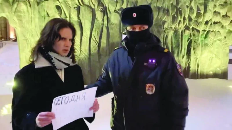 
A woman protesting the death of Alexei Navalny is detained in Moscow. 