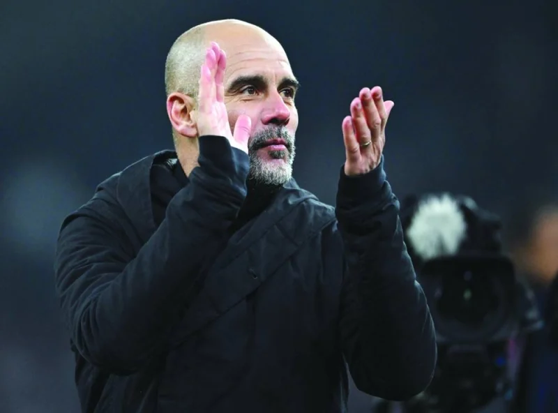 Manchester City&#039;s Spanish manager Pep Guardiola celebrates after the UEFA Champions League round of 16, first-leg football match between FC Copenhagen and Manchester City in Copenhagen, Denmark, recently. (AFP)