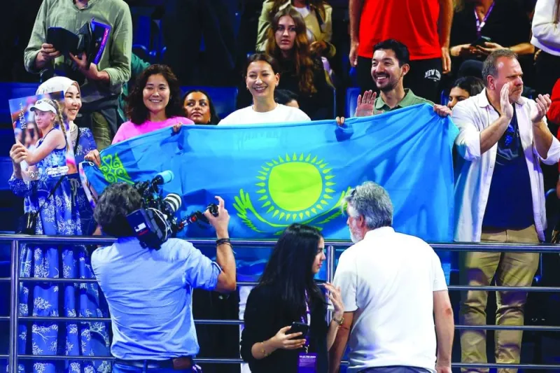 Kazakhstan fans cheer for Elena Rybakina during her match against Anastasia Pavlyuchenkova of Russia in Doha on Friday. (AFP)
