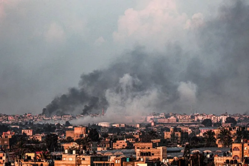 A picture taken from Rafah shows smoke billowing over Khan Yunis in the southern Gaza Strip during Israeli bombardment on Sunday. AFP