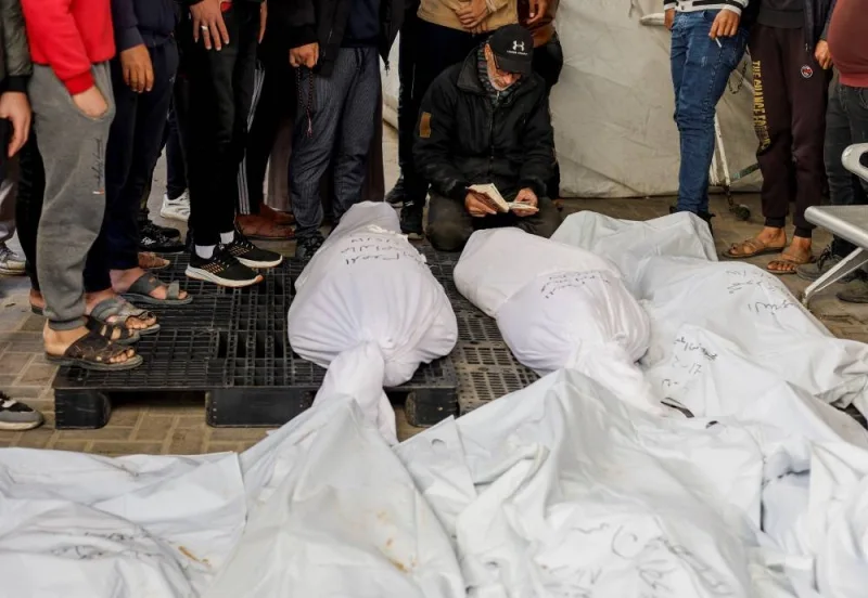 Mourners react next to the bodies of Palestinians killed in Israeli strikes at Abu Yousef Al-Najjar hospital in Rafah, on Sunday. REUTERS