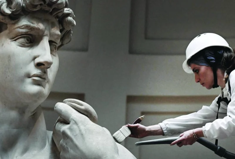 
Italian restorer Eleonora Pucci cleans Michelangelo’s statue of David. (AFP) 