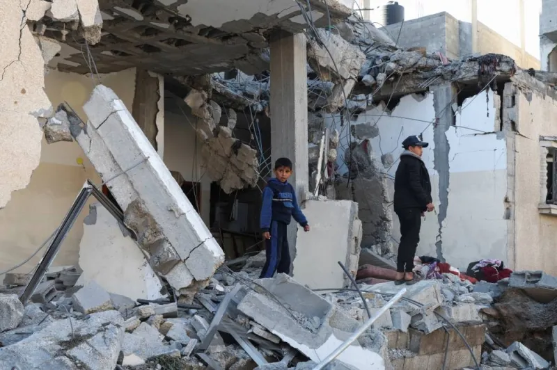 Palestinians inspect the site of an Israeli strike on a house in Rafah on Wednesday. REUTERS