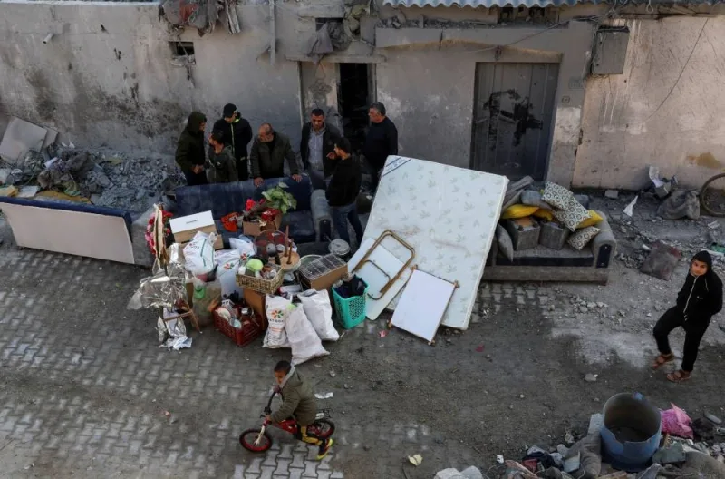 Palestinians gather at the site of an Israeli strike on a house in Rafah on Wednesday. REUTERS