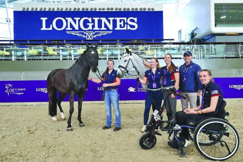Para-Dressage Riders pose after a training session on Wednesday.