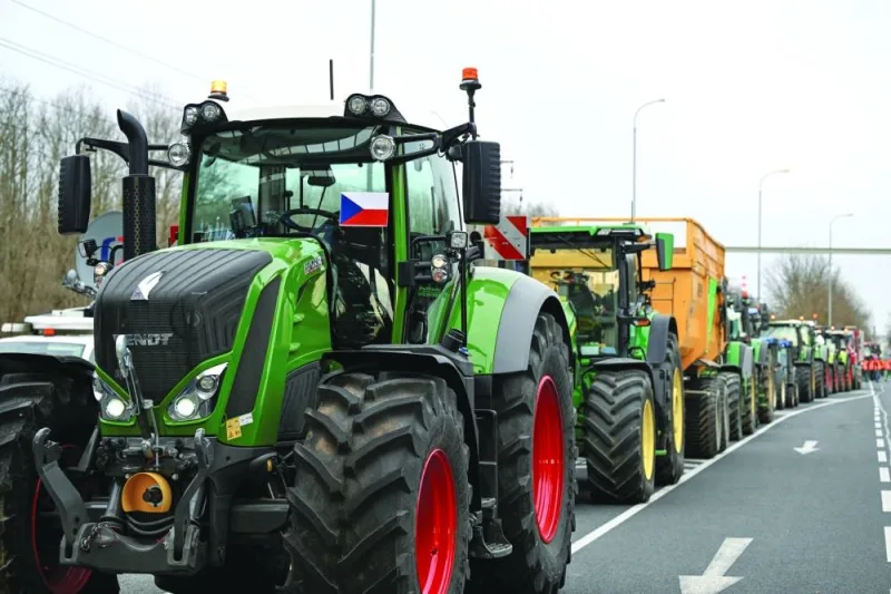 
Tractors queue as farmers protest against the European Union’s agricultural policies, grievances shared by farmers across Europe, at the Czech-Slovak border near Holic, Slovakia. 