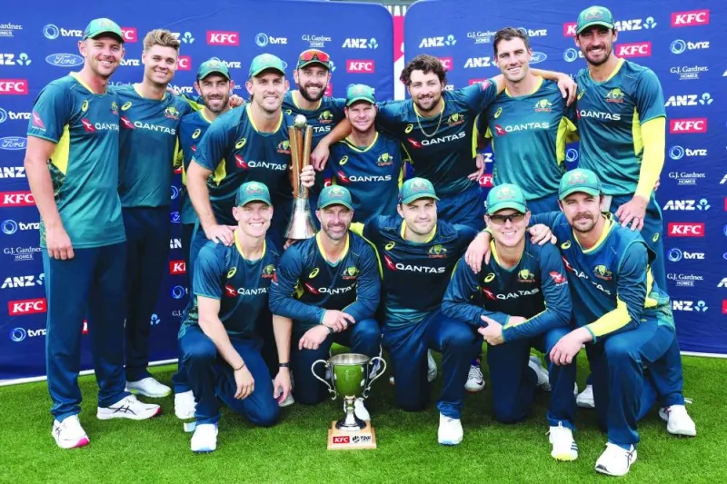Australia players pose as they celebrate winning the series 3-0 after the third Twenty20I against New Zealand at Eden Park in Auckland on Sunday. (AFP)
