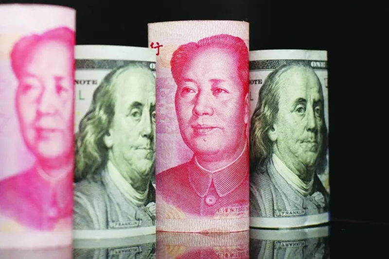 Banknotes of Chinese yuan and US dollar are seen in an illustration picture. China’s role as a big supplier of savings to the rest of the world may also diminish as it’s pressured by the US on a variety of trade and technological fronts.
