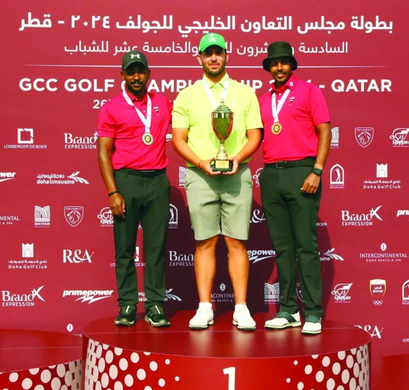 First placed Saudi Arabia’s Khalid Attieh (centre), second placed Qatar’s Saleh al-Kaabi (left) and Qatar’s Ali al-Sharani pose with their GCC Golf Championship trophies at the DGC on Sunday.