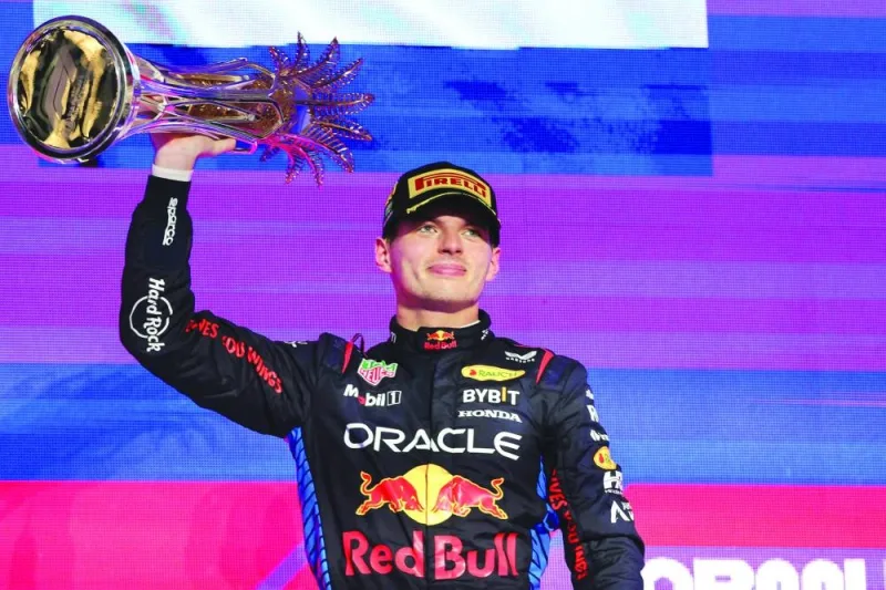 Red Bull Racing&#039;s Dutch driver Max Verstappen celebrates with trophy after winning the Saudi Arabian Formula One Grand Prix at the Jeddah Corniche Circuit in Jeddah on Saturday. (AFP)