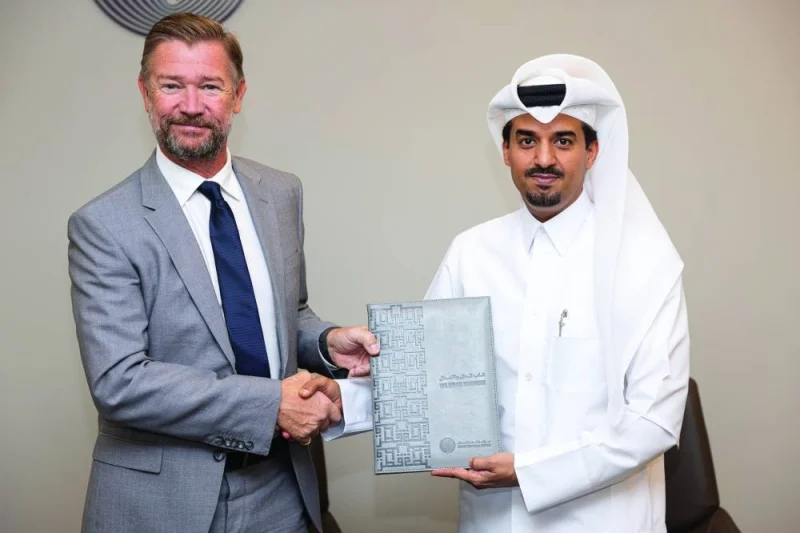 Abdulla Mohamed al-Hajri, chief operating officer, QFC; and Matthew Cowan, regional director (Middle East and North Africa), CISI, after signing the pact.