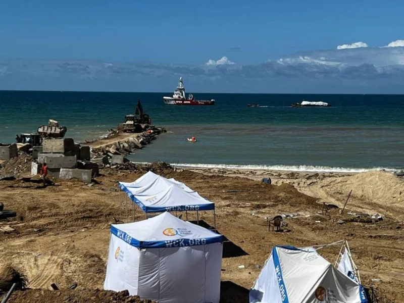 A barge carrying humanitarian aid being transported towards the Gaza Strip. A first aid ship plying a new maritime corridor from Cyprus began unloading its cargo of desperately needed food in Gaza Friday as Hamas proposed a new six-week truce in the war. Israeli Army / AFP