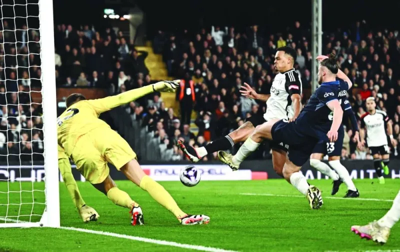 
Fulham’s Rodrigo Muniz (centre) scores against Tottenham Hotspur during the Premier League match at the Craven Cottage in London yesterday. (Reuters) 