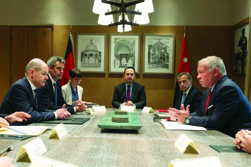 
A handout picture released by the Jordanian Royal Palace yesterday, shows Jordan’s King Abdullah II meeting with German Chancellor Olaf Scholz (left) in Amman, during his visit to the region. 