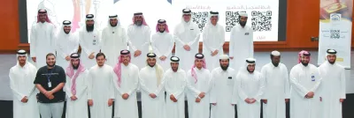 Some of the attendees at the event are seen with Sheikh Dr Muhammad al-Barrak and QU officials.