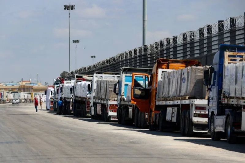 Trucks line up near the Rafah border crossing between Egypt and the Gaza Strip, in Rafah, Egypt, on Saturday. REUTERS