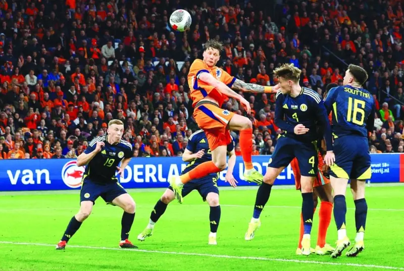 
Netherlands’ Wout Weghorst scores against Scotland during the friendly match in Amsterdam on Friday. (Reuters) 