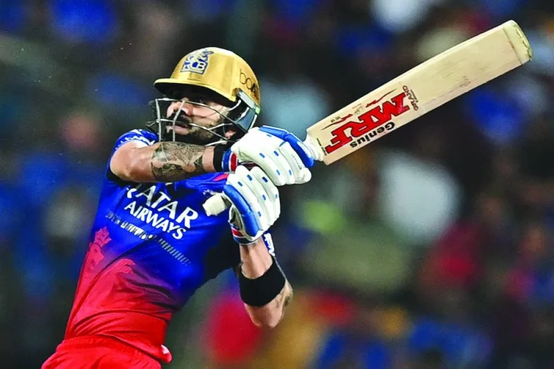 Royal Challengers Bengaluru’s Virat Kohli watches the ball after playing a shot during the Indian Premier League match against Punjab Kings in Bengaluru on Monday. (AFP)