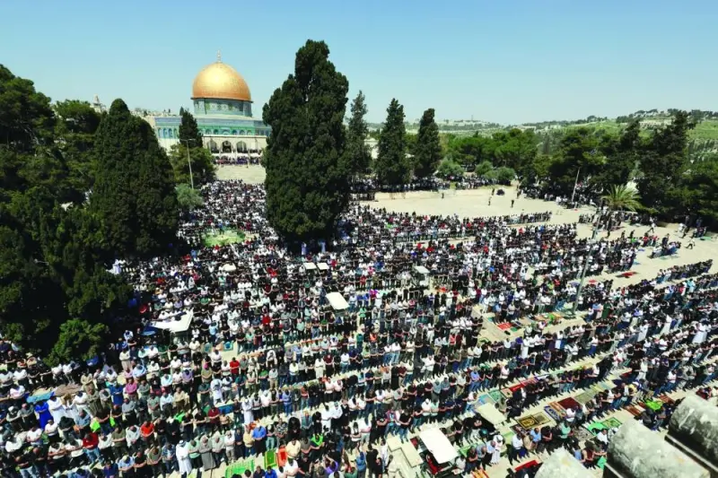 Muslim Palestinian worshippers participate in the last Friday prayers of Ramadan, on the Al-Aqsa compound, amid the ongoing conflict between Israel and the Palestinian Hamas group, in Jerusalem's Old City, yesterday.