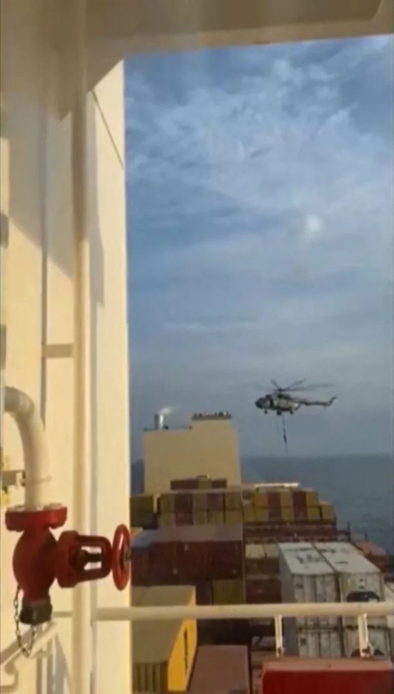 This image grab taken from a UGC video posted on social media on Saturday shows Iran&#039;s Revolutionary Guards rappelling down onto a container ship named, MSC Aries, near the Strait of Hormuz. AFP
