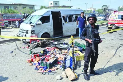 Police officers are seen at the site of an attack in Karachi on Friday.