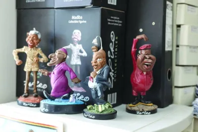 Figurines created by South African cartoonist Jonathan Shapiro, known as Zapiro, of (from left) former South African President Nelson Mandela, Archbishop Desmond Tutu, former South African President Jacob Zuma and Economic Freedom Fighters (EFF) leader Julius Malema, are displayed at his studio in Cape Town.
