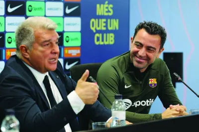 FC Barcelona President Joan Laporta (left) and Barcelona’s coach Xavi during a press conference in Sant Joan Despi, Barcelona, on Thursday. (AFP)