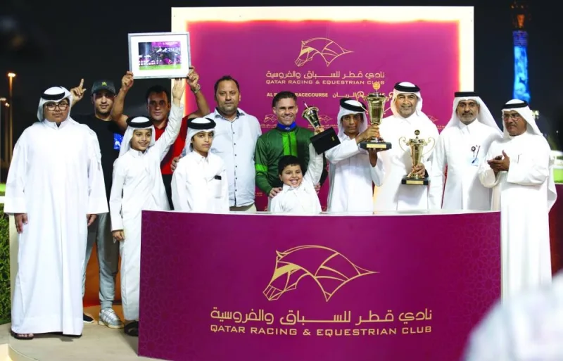 The connections of General Panic celebrate after the bay horse won the End Of Season Cup at Al Rayyan Racecourse on Thursday. PICTURES: Juhaim