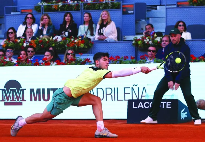 Spain’s Carlos Alcaraz returns the ball to Germany’s Jan-Lennard Struff during the Madrid Open match in Madrid on Tuesday. (AFP)
