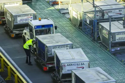 A cargo handler prepares air freight containers for a British Airways flight at Heathrow Airport, in London. The air cargo sector stands as an indispensable linchpin in the realm of global trade, boasting unparalleled attributes of speed, global connectivity, reliability, and efficiency.