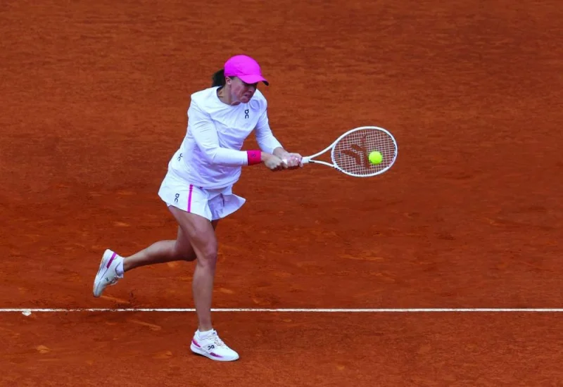 Poland’s Iga Swiatek returns the ball to Madison Keys of the United States during their 2024 Madrid Open semi-final in Madrid on Thursday. (AFP)