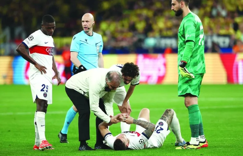 
Paris Saint-Germain’s Lucas Hernandez lies on the ground after getting injured during the Champions League semi-final first leg match against Borussia Dortmund on Wednesday. (AFP) 