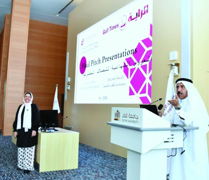 Abdulaziz Faraj al-Ansari speaks at the event as Dr Dalia Farrag looks on.
